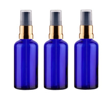 Load image into Gallery viewer, 50ml Blue Glass Bottles with Gold/Black Treatment Pump and Clear Overcap